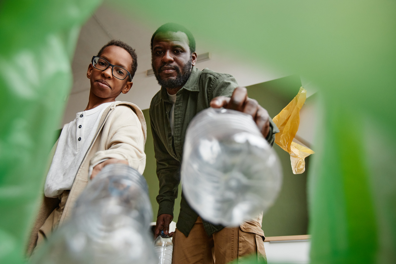 African American Sorting Waste for Recycling